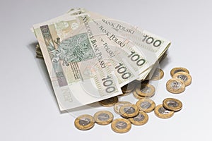 Heap of polish currency with gold coins