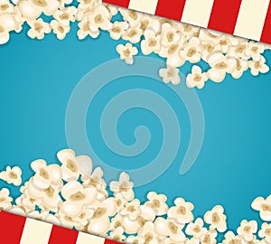 Heap popcorn for movie lies on blue background.