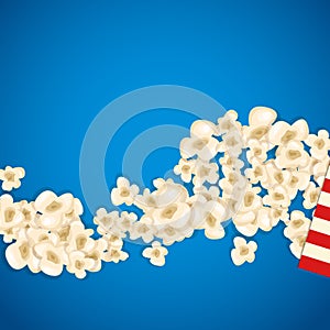 Heap popcorn for movie lies on blue background.