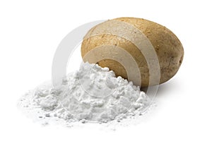 Heap of potato starch and a fresh potato