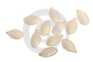 Heap of pumpkin seeds isolated on white background. Top view. Flat lay