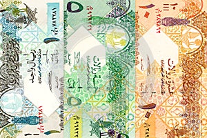 Heap of qatari riyal bank notes background
