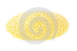 Heap of raw, uncooked couscous over white