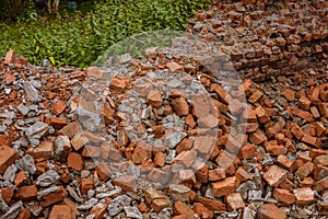 Heap of the red bricks which have stayed at home after destroyed