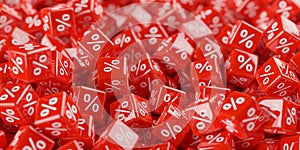 Heap of red cubes or dice with percent sign symbol, sale, discount or sales price reduction concept background, selective focus