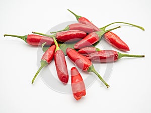 Heap of red hot chilly peppers on white