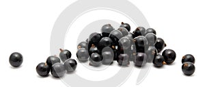 Heap of ripe black currant on a white
