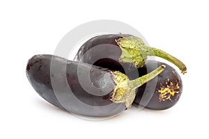 Heap of ripe eggplants on white background