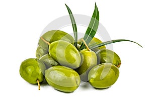 Heap of ripe green olives with leaves on white background