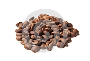 Heap of roasted coffee beans on white