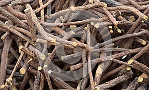 Heap of scattered licorice roots. Food background