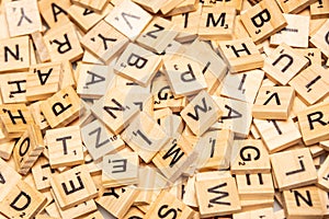 Heap of scrabble tile letters from above