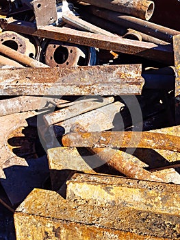 Heap of scrap iron. Pile of secondary raw materials. Iron raw materials ready for recycling. Collected scrap metal
