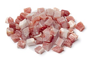 Heap of smoked bacon cubes isolated on white background