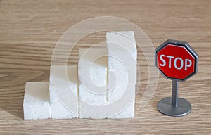 Heap of sugar cubes and stop roadsigns