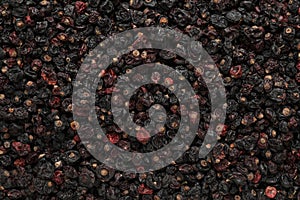 Heap of tasty dried currants as background, top view