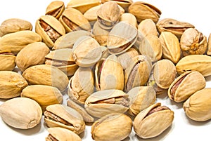 Heap of tasty roasted pistachios closeup photo