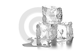 Heap of three melting ice cubes with water and reflection