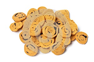 Heap of traditional Krichlate spicy miniature shortbread cookies on white background