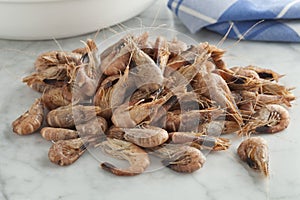 Heap of unpeeled brown shrimps photo