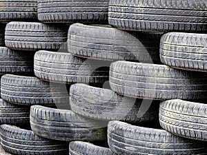 Heap of used car tyres background