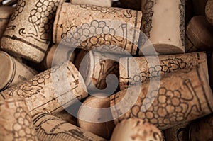 Heap of used vintage wine corks close-up.