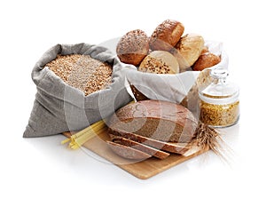 Heap of various bread, bag with wheat and macaroni