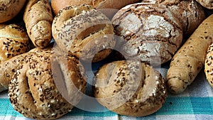 Heap of various bread rolls sprinkled