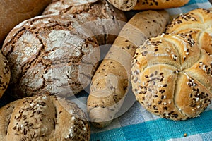 Heap of various bread rolls sprinkled