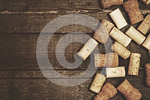 Heap of vintage wine corks on wooden table
