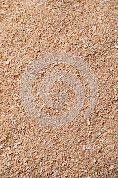 Heap of wheat bran as background, top view