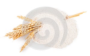 Heap of wheat flour with spikelets