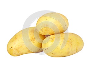 Heap of yellow raw potatos