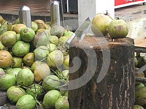 The heap of young coconuts and backsword