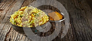 Heaped bowl of savory quinoa and couscous