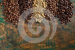 Heaps of assorted raw and roasted coffee beans photo