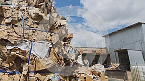Heaps of cardboard at industrial landfill, ecology concept