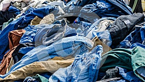 Heaps of clothing on the second hand market