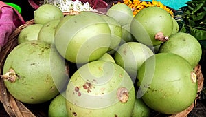 Heaps of green wood apple belugiri fruit to sell in the market