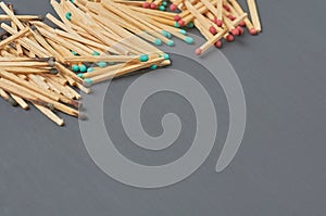 Heaps of many used and new matchsticks on dark concrete table on kitchen