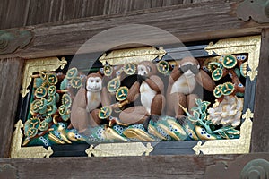 Tree wise monkeys at Toshogu Shrine in Nikko, Japan photo