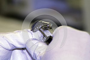 Hearing aid acoustician working on a hearing aid photo