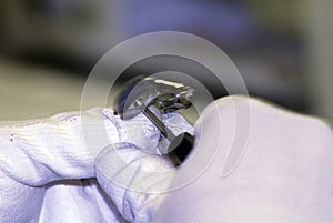 Hearing aid acoustician working on a hearing aid