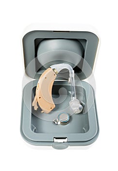 Hearing aid with box standing with battery on white isolated background