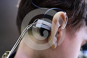 Hearing Aid in Boy`s Ear