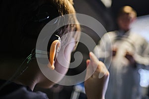 Hearing Aid in Boy`s Ear