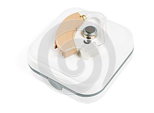 Hearing aid on a closed box close-up on a white isolated background