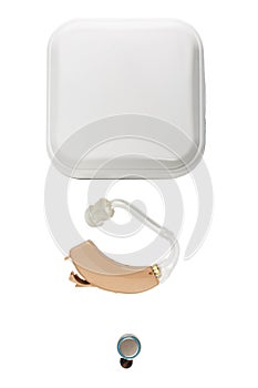 Hearing aid with a closed box lie exactly close-up on a white isolated background