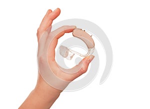 Hearing aid between fingers