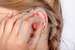 Hearing aid inserting close up